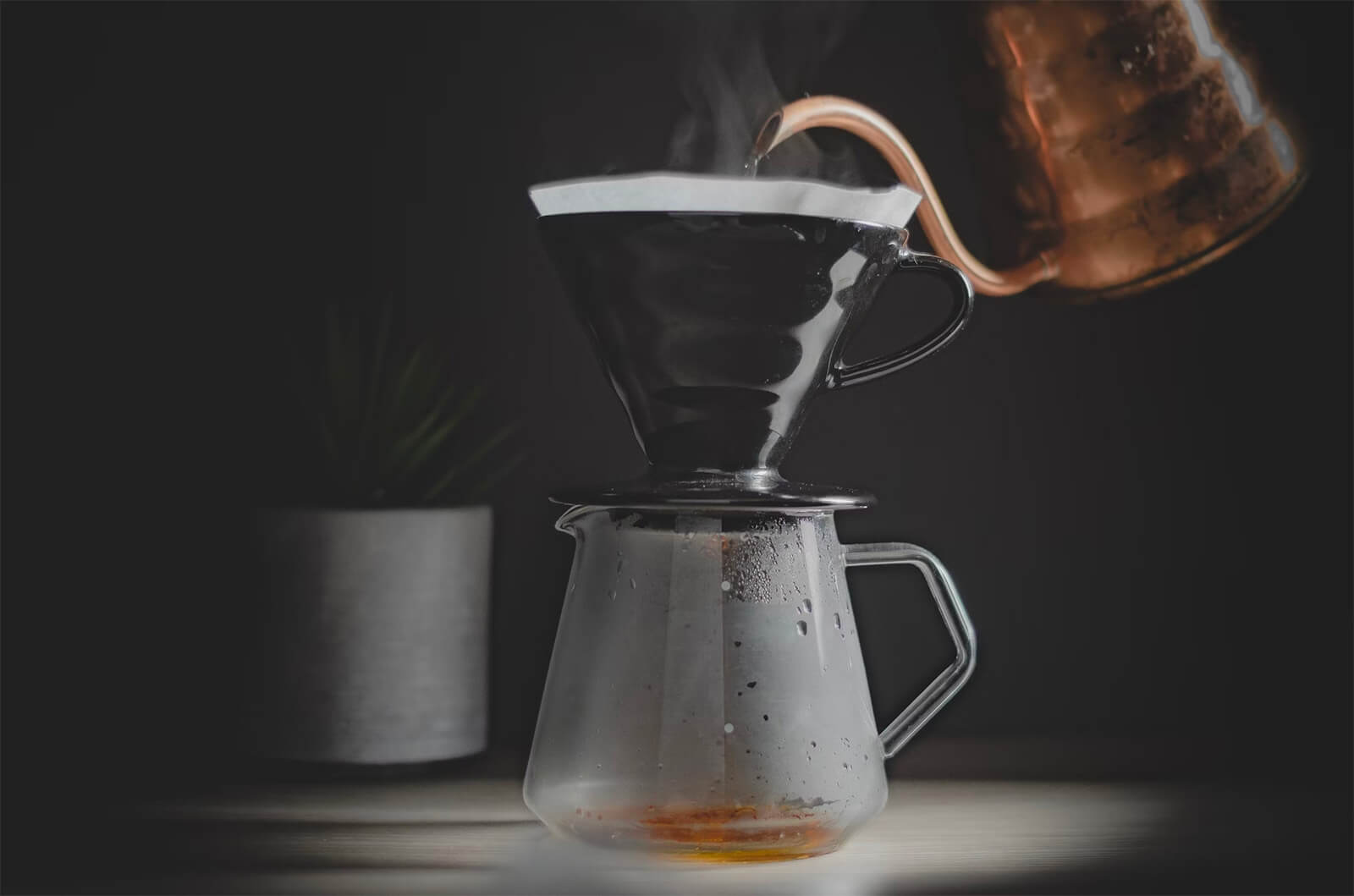 A pour-over coffee dripper mid-brew